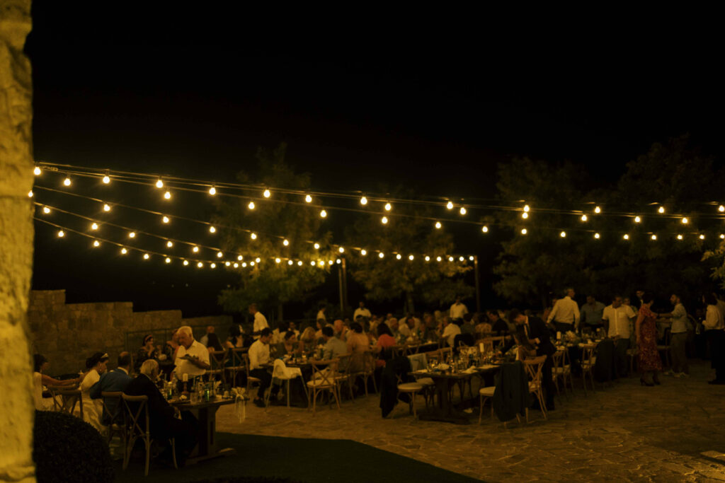 outdoor dinner wedding festoon lighting